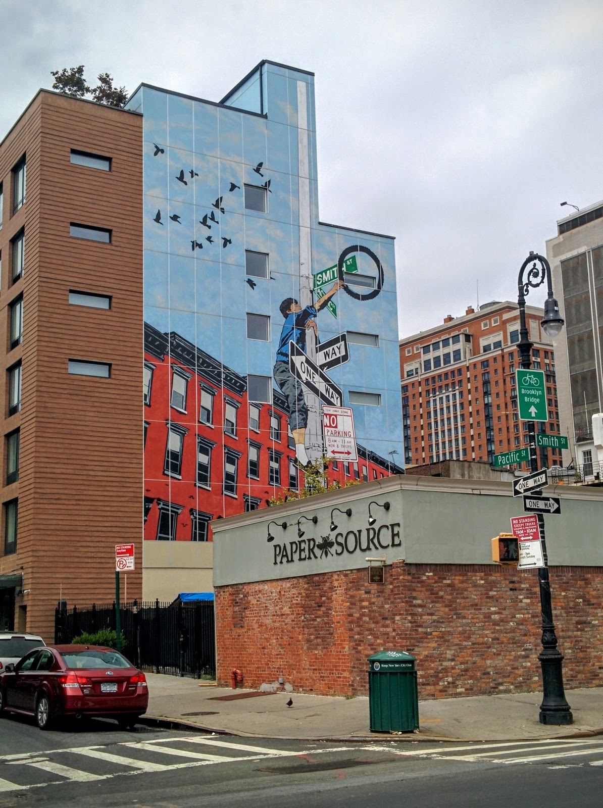 Photo of Wallart "A boy climbs a lamppost" in Kings County City, New York, United States - 1 Picture of Point of interest, Establishment